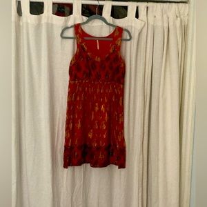 Size 4 red and gold printed mini dress